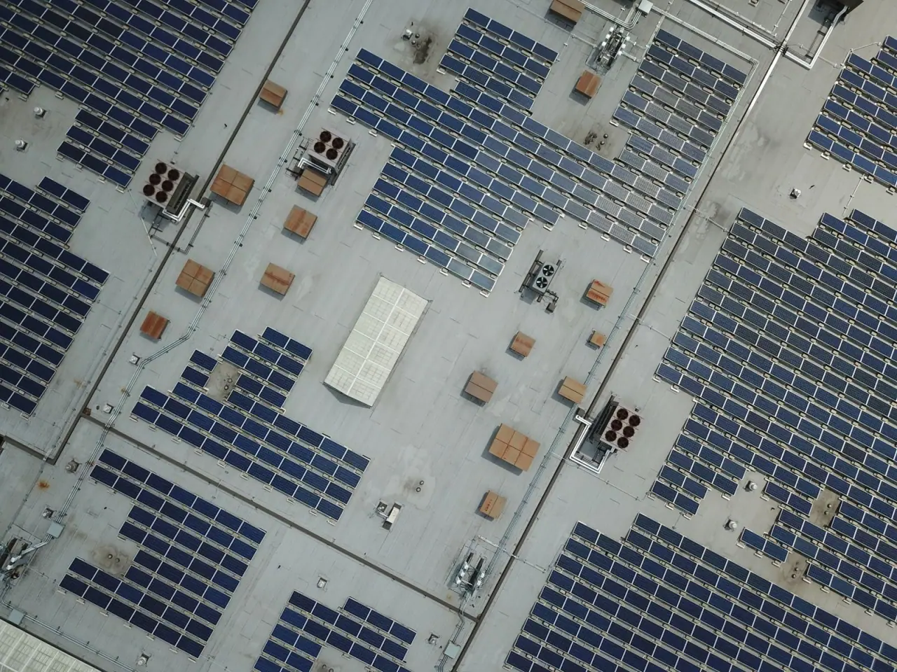 A large rooftop array on a commercial building photographed from a high angle