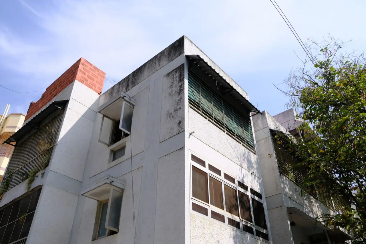 A mid-rise commercial building in Bengaluru against a clear sky